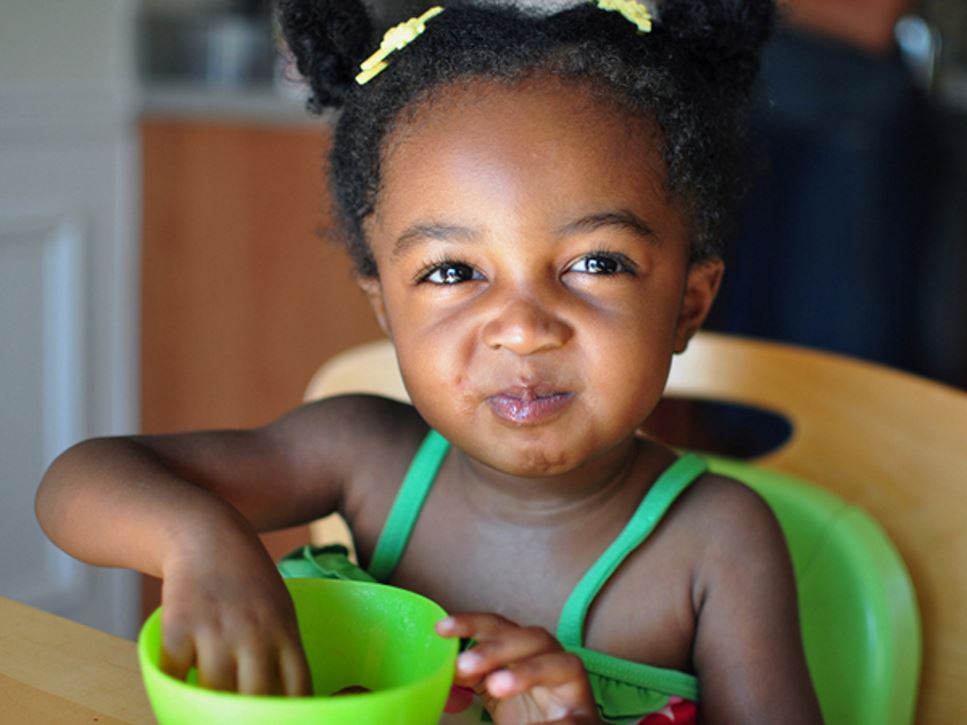 Toddler having a snack - 4 Toddler Snacking Mistakes