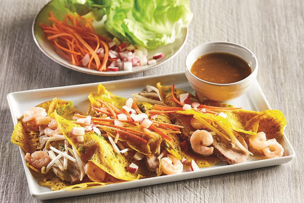 Platter of Vietnamese Shrimp Pork Crepes with dipping sauce